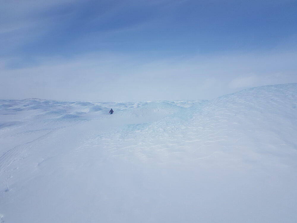 Greenland landscape with Inspiring Explorers Expedition&trade; team member in background