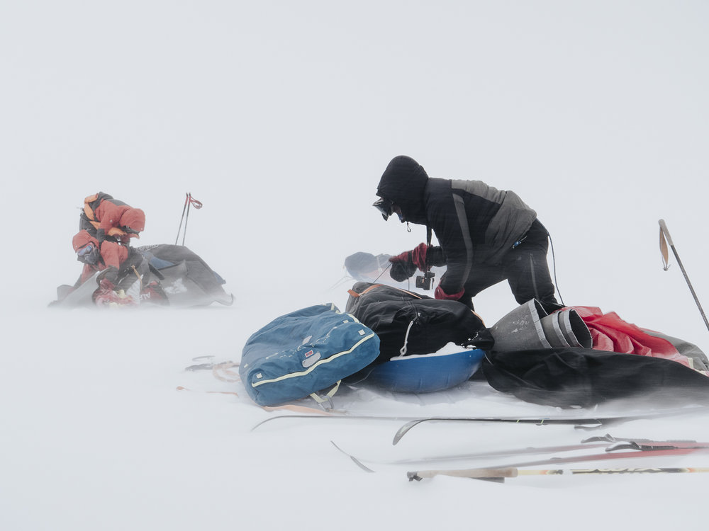 Inspiring Explorers Expedition&trade; team organising their gear in high winds