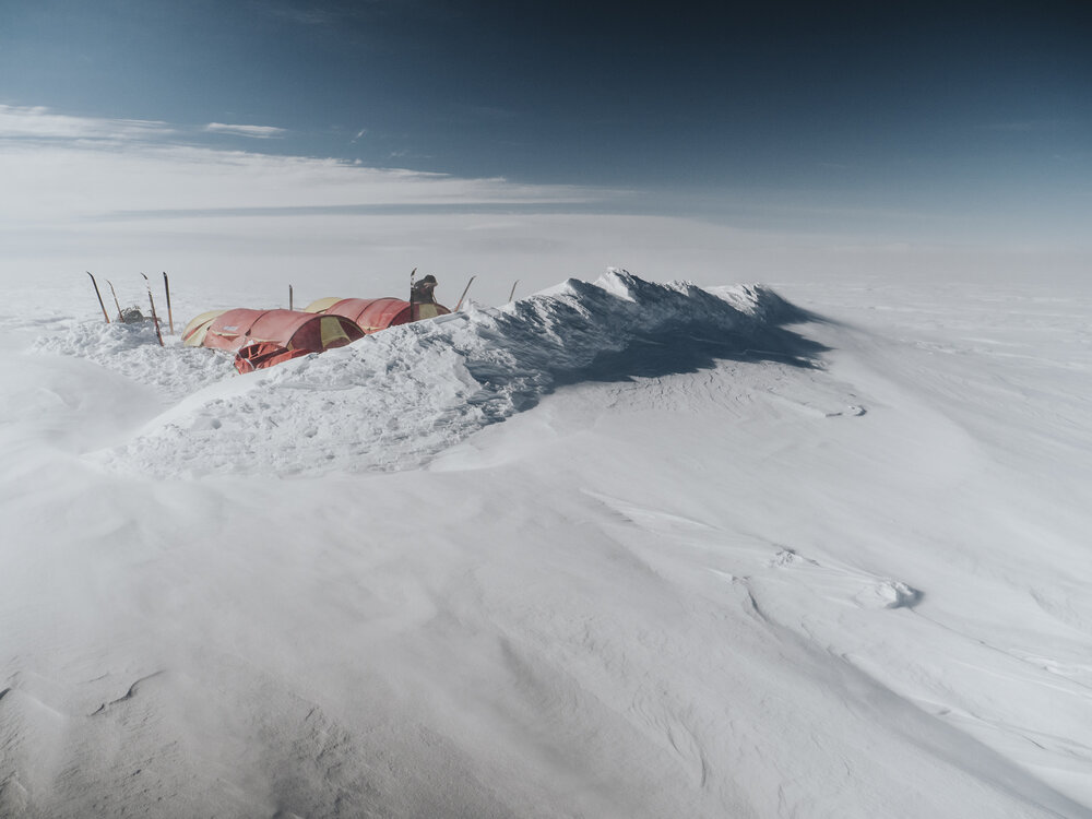 Snow wall shovelled to protect the team's tents (001)