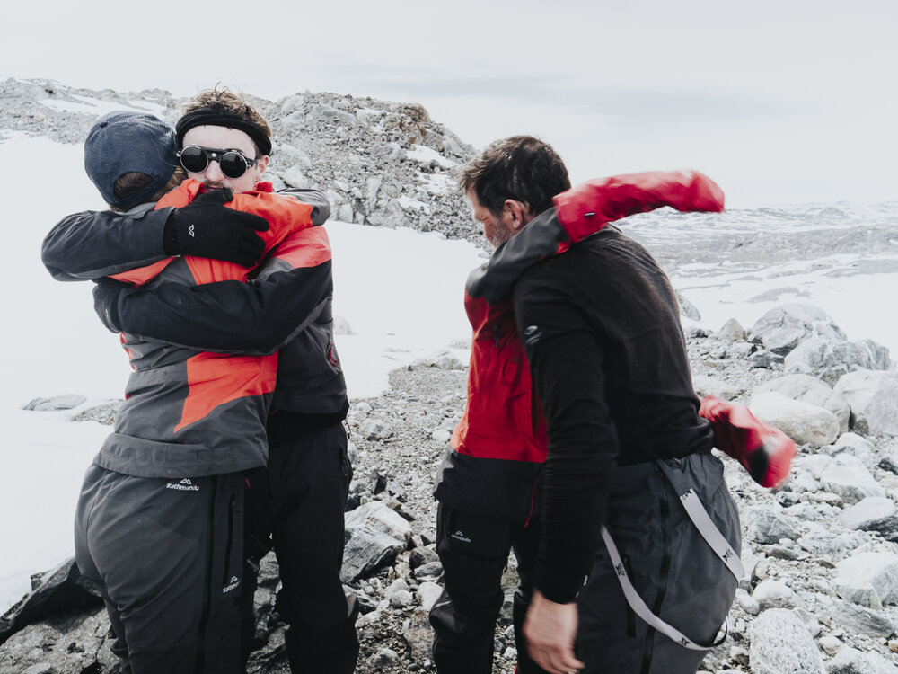 Inspiring Explorers Expedition&trade; team hugs after completing the crossing