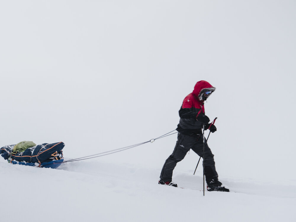 An Inspiring Explorers Expedition&trade; team member pulling a sled