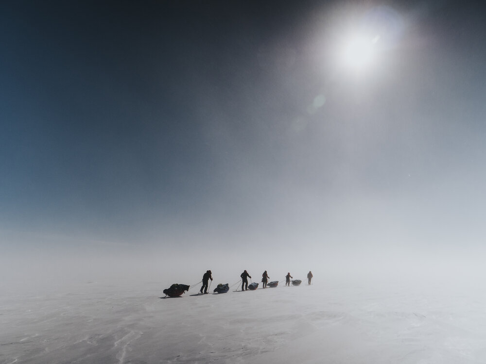 Inspiring Explorers Expedition&trade; team crossing with sleds 