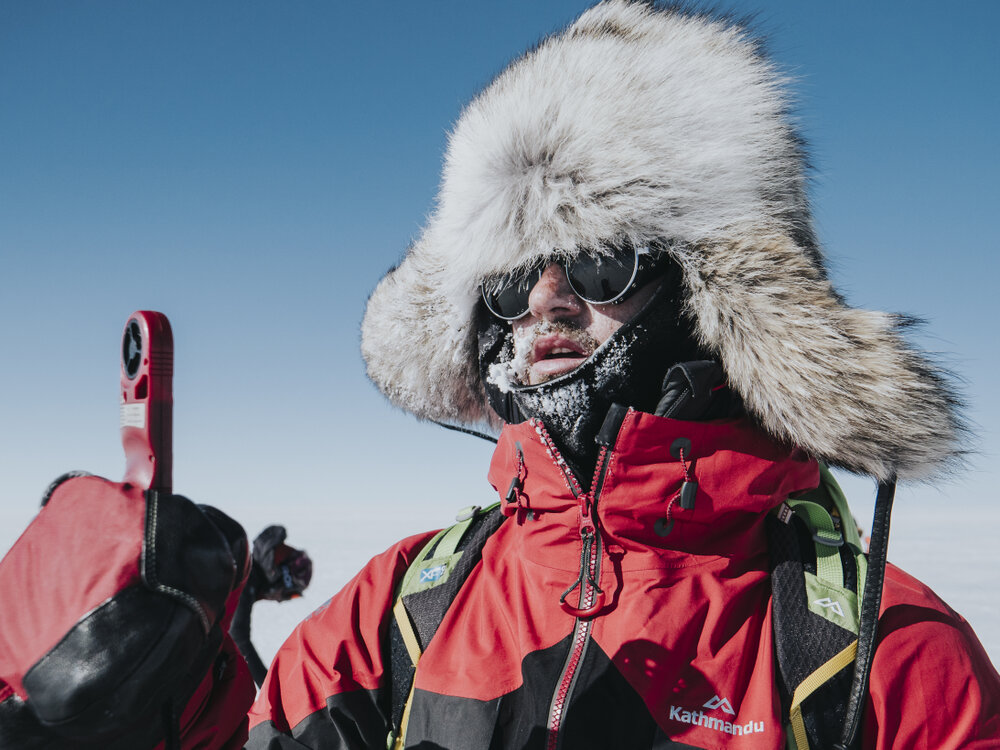 Inspiring Explorer Brando Yelavich measures wind speed during the Greenland Ice Cap crossing