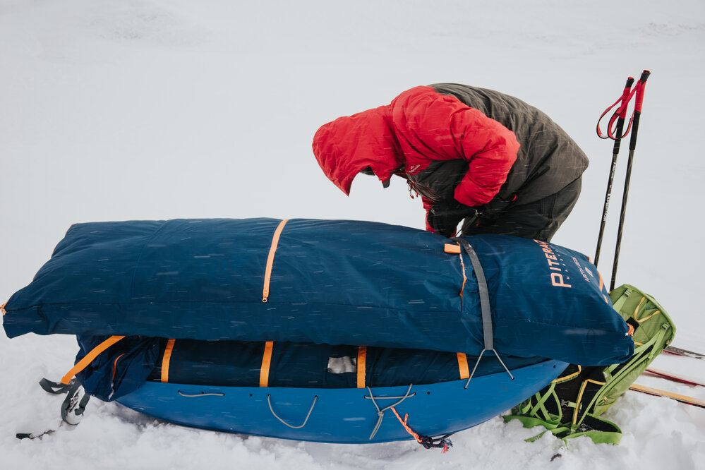 An Inspiring Explorers Expedition&trade; team member adjusting sled