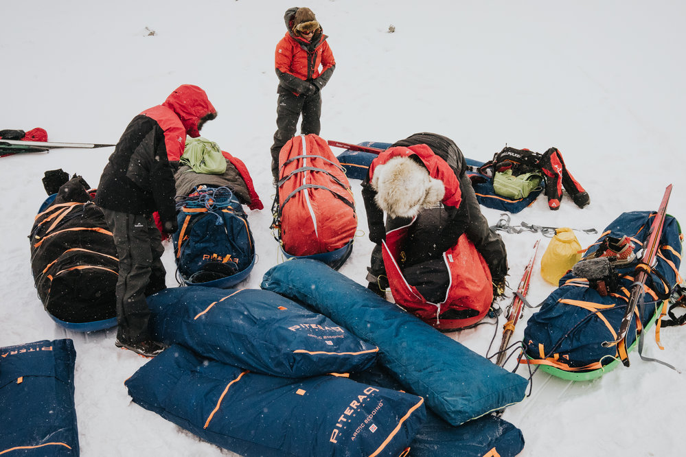Inspiring Explorers organising gear into sleds