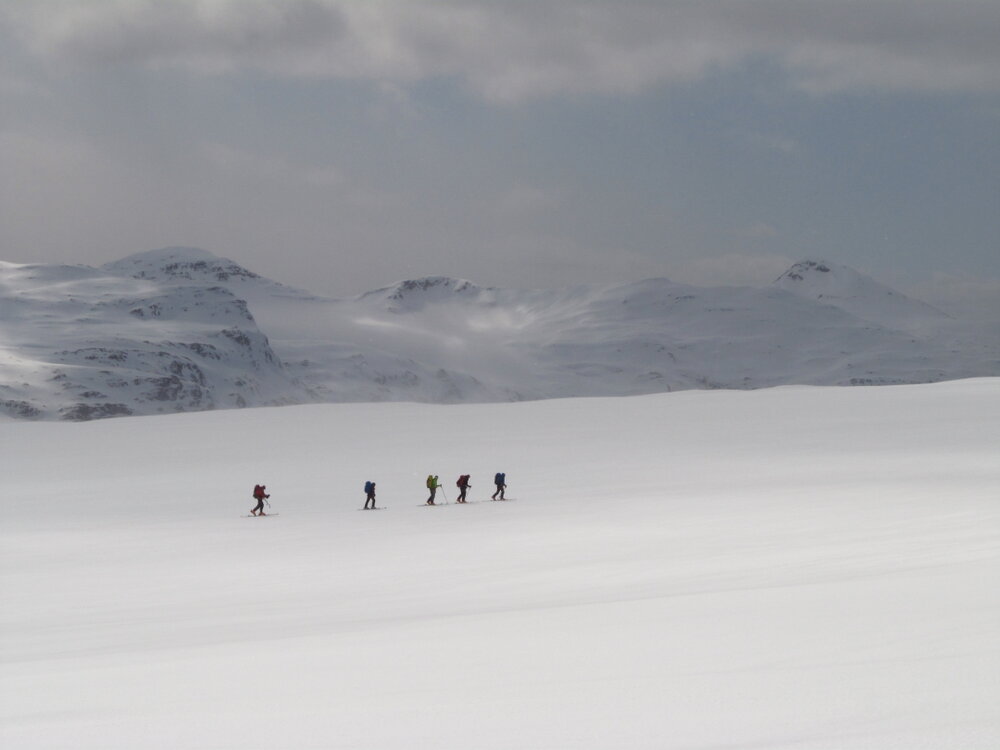 Inspiring Explorer expedition members dwarfed by the mountains in South Georgia