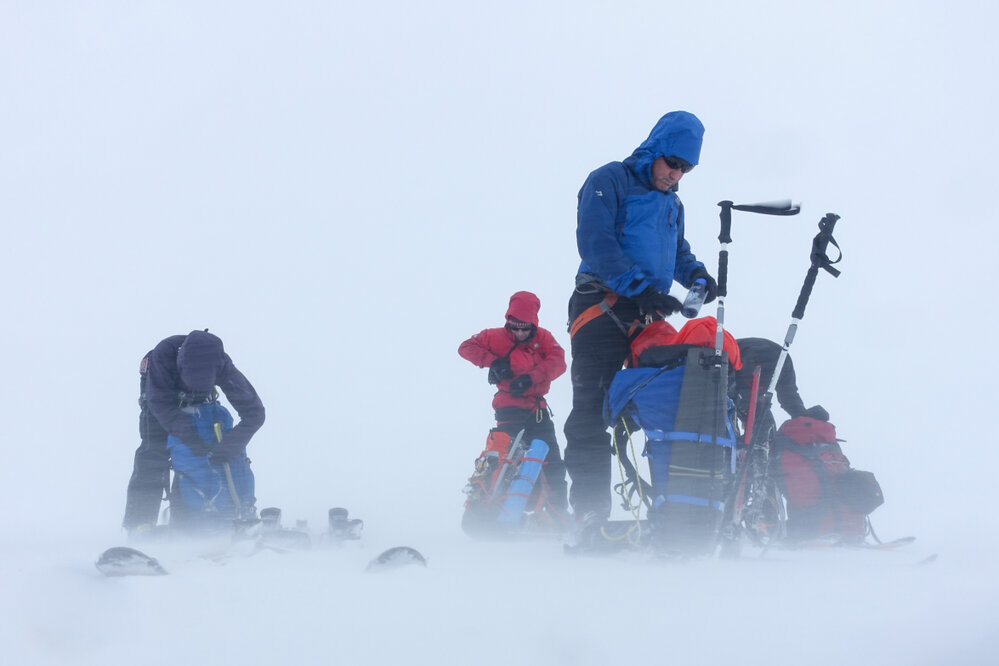 Members of the Antarctic Heritage Trust Inspiring Explorers Expedition&trade; and their packs in whiteout conditions during their ski crossing of South Georgia