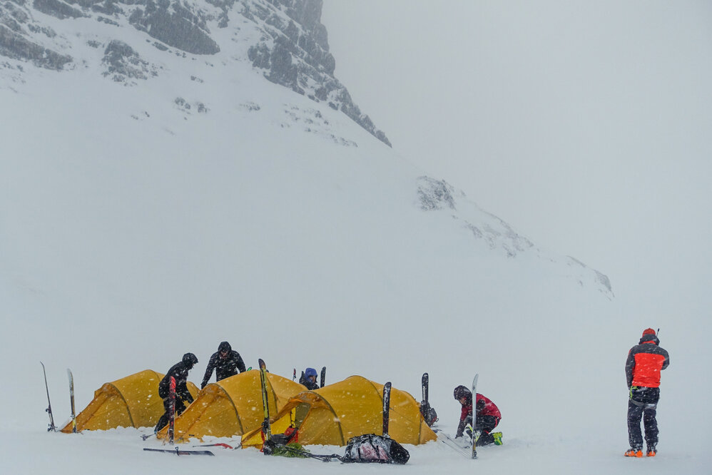 Members of the Antarctic Heritage Trust Inspiring Explorers Expedition&trade; pitching their tents in snowy conditions during their ski crossing of South Georgia