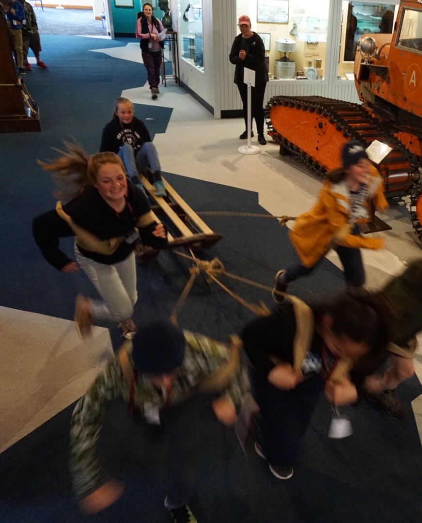 Young Inspiring Explorers pulling a sled at the Canterbury Museum