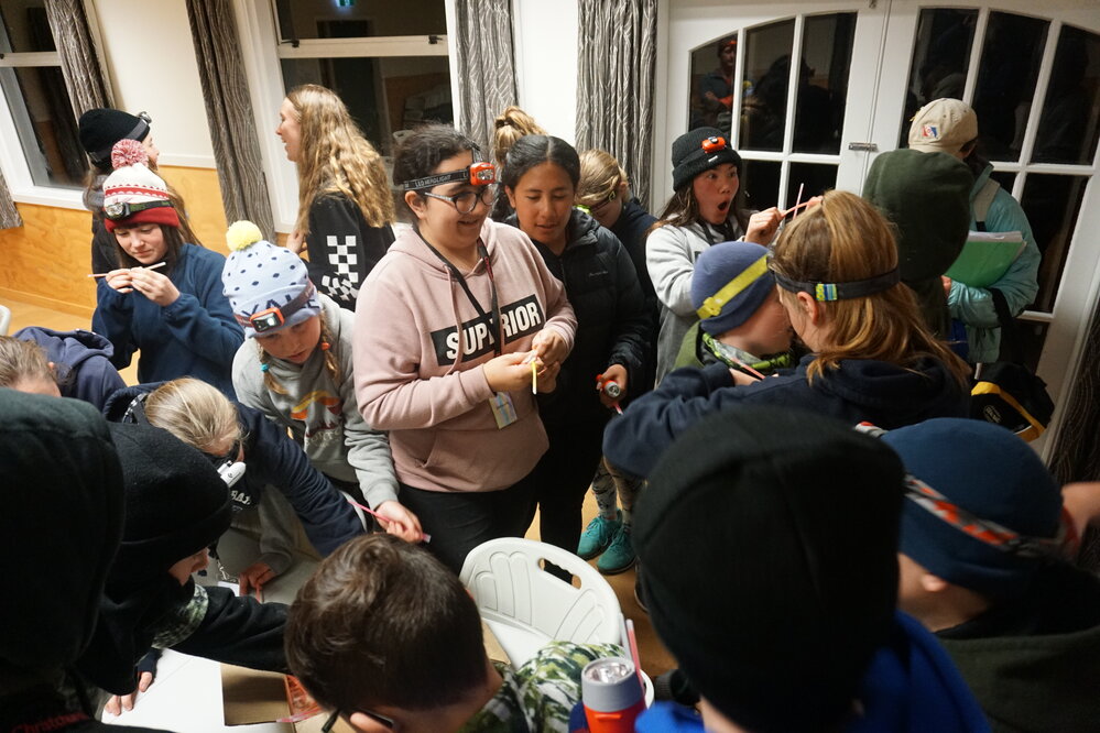 Young Inspiring Explorers prepare for evening activities