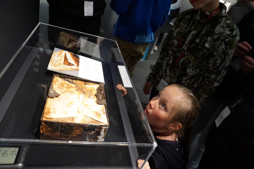 Young Inspiring Explorer Holly with the Century-Old Fruit cake