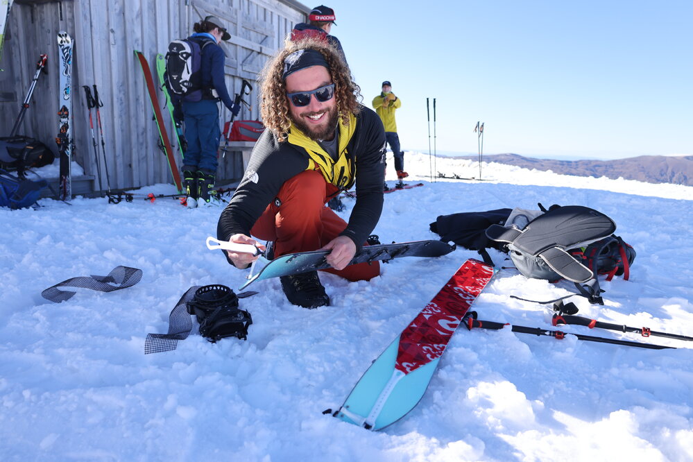 Inspiring Explorer Isaac Giesen applies ski skins to his skis (008)
