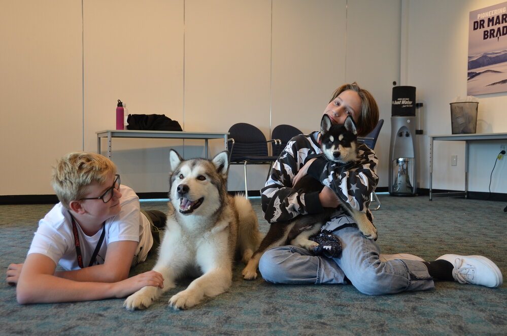 Young Inspiring Explorers&trade; Benjamin and Christie meet the huskies at the International Antarctic Centre