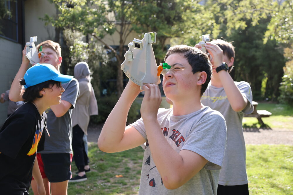 Young Inspiring Explorer Archie uses a sextant