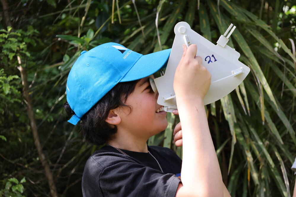 Young Inspiring Explorer Kyren uses a sextant