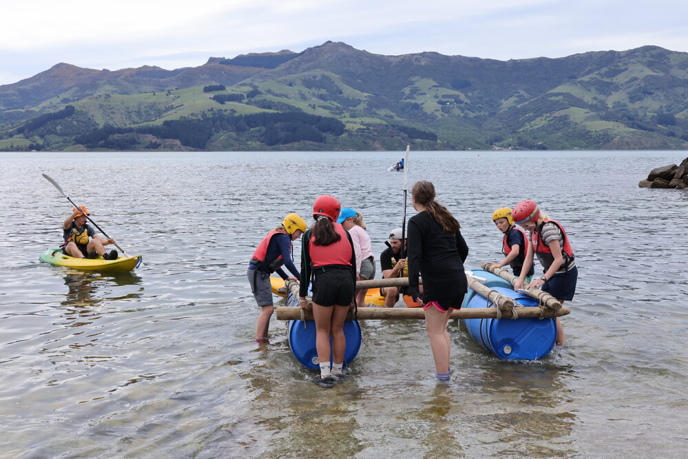 Young Inspiring Explorers carry their rafts to the water (006)