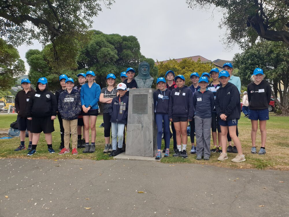 Young Inspiring Explorers with a bust of Frank Worsley in Akaroa