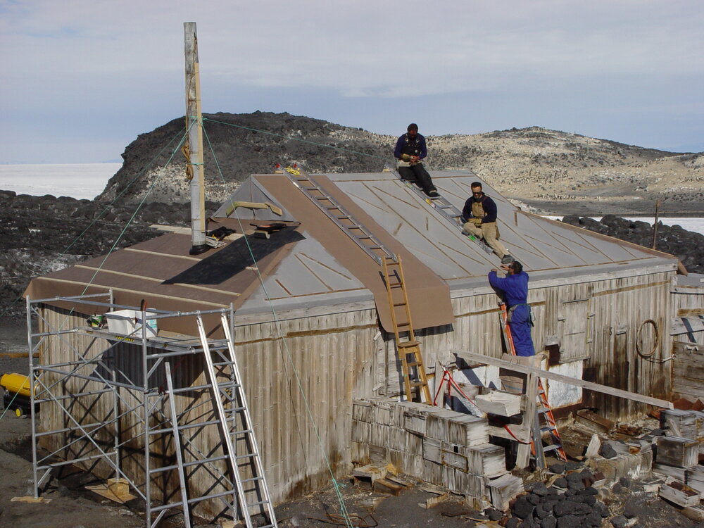 2006 AHT K441 team working on roof repairs at Shackleton's 'Nimrod' hut, Cape Royds