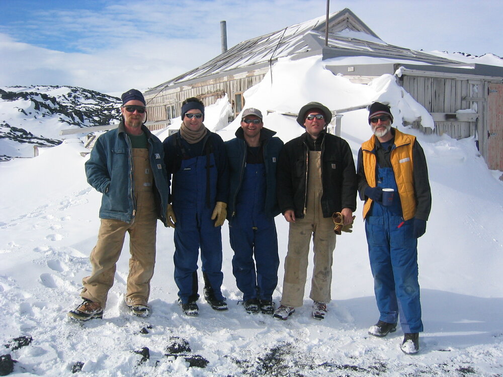 2005 AHT K440 team with Nigel Watson outside Shackleton's 'Nimrod' hut, Cape Royds