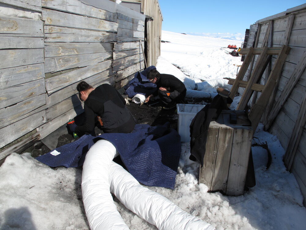 2009-10 AHT's Fran Clarke and Lizzie Meek excavating coal briquettes, Scott's 'Terra Nova' hut