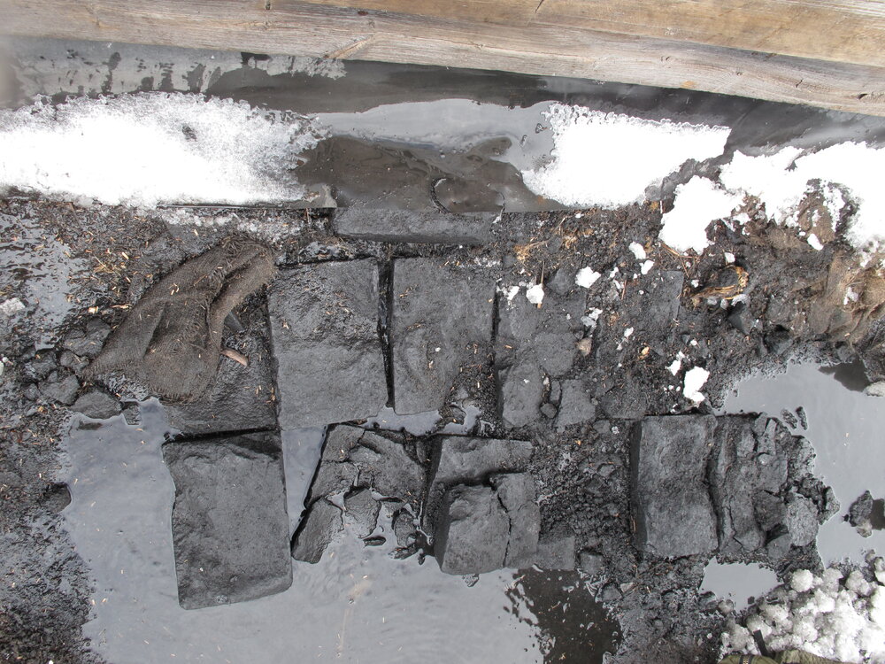 2009-10 Coal briquettes during excavation, Scott's 'Terra Nova' hut