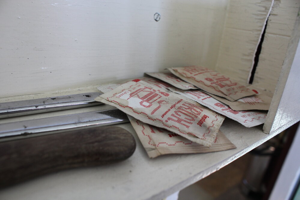 2019-20 Baseline image - Coffee creamer in wall-mounted box, Kitchen (Room 6), Hillary's TAE/IGY Hut