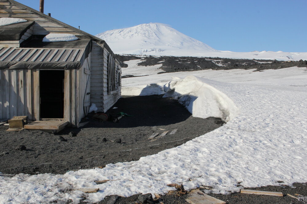2019-20 Hut inspection - Main Annexe entrance in southwest corner with Mount Erebus beyond, Scott's Hut, Cape Evans