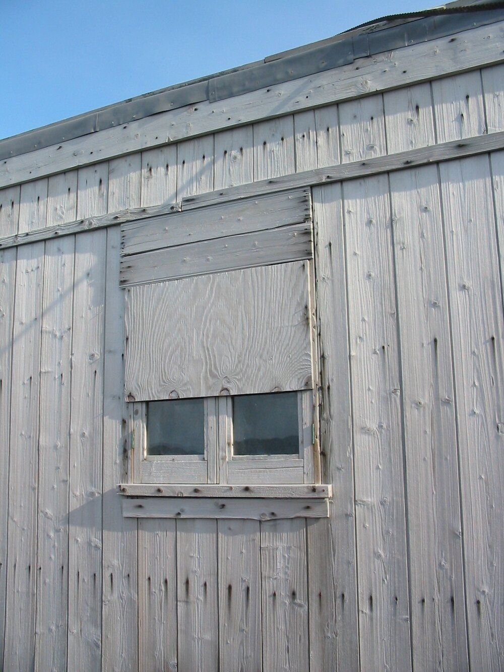 2003 K440 at Shackleton's 'Nimrod' hut, exterior - Partially covered South-east window