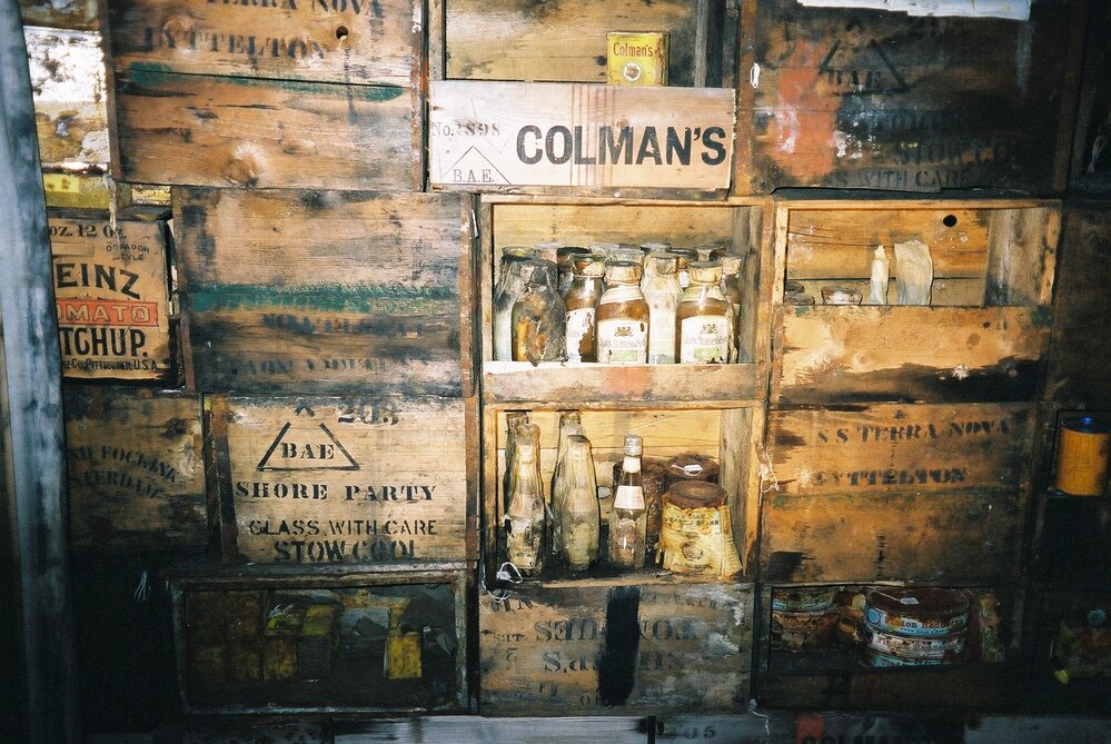 2002 Scott's 'Terra Nova' hut, interior - Galley bulkhead stores boxes (002)
