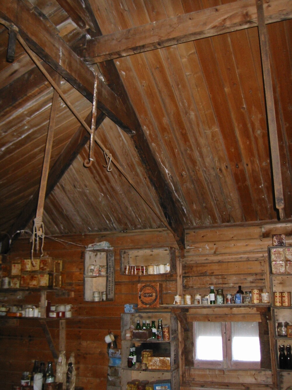 2002 K440B to Shackleton's 'Nimrod' hut, interior - Stores on South wall (002)