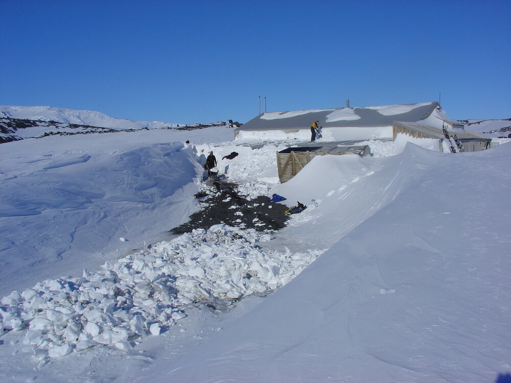 2006 Conservators at work, removing snow from Scott's 'Terra Nova' hut
