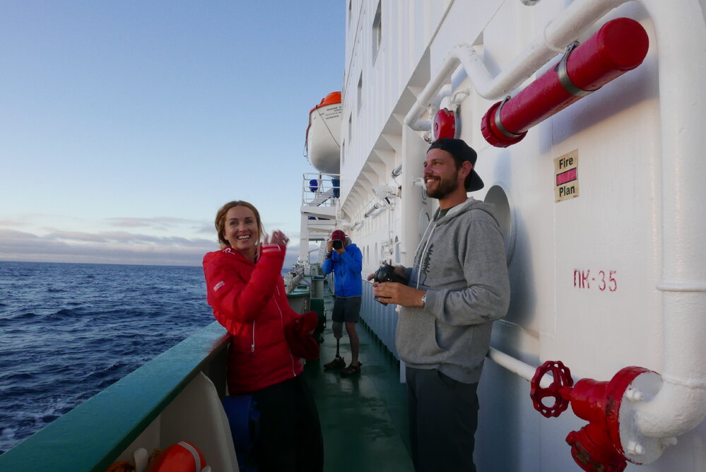 Inspiring Explorers on deck in the Drake passage on their way to the Antarctic Peninsula