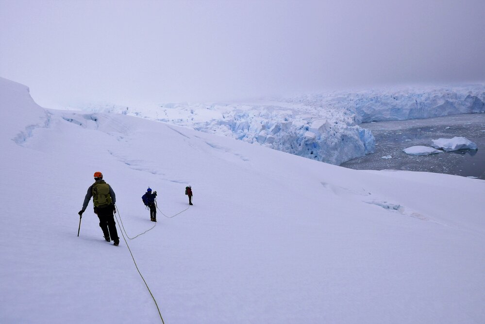  Inspiring Explorers Expedition&trade; team members traversing crevassed slopes during their climb of Mount Scott