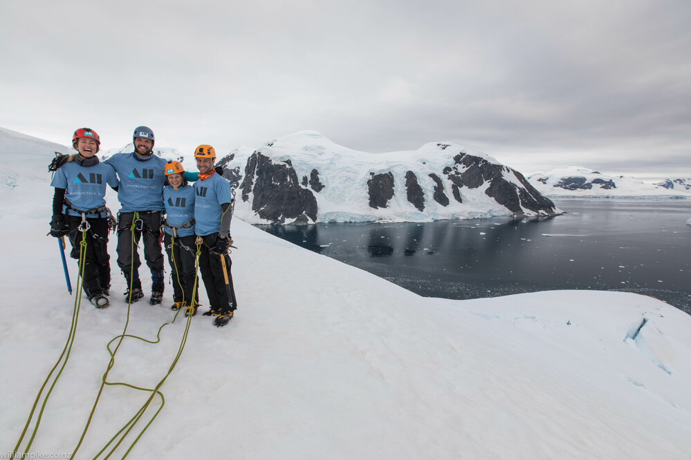 Inspiring Explorers wear their Antarctic Heritage T-shirts on the Mount Scott expedition