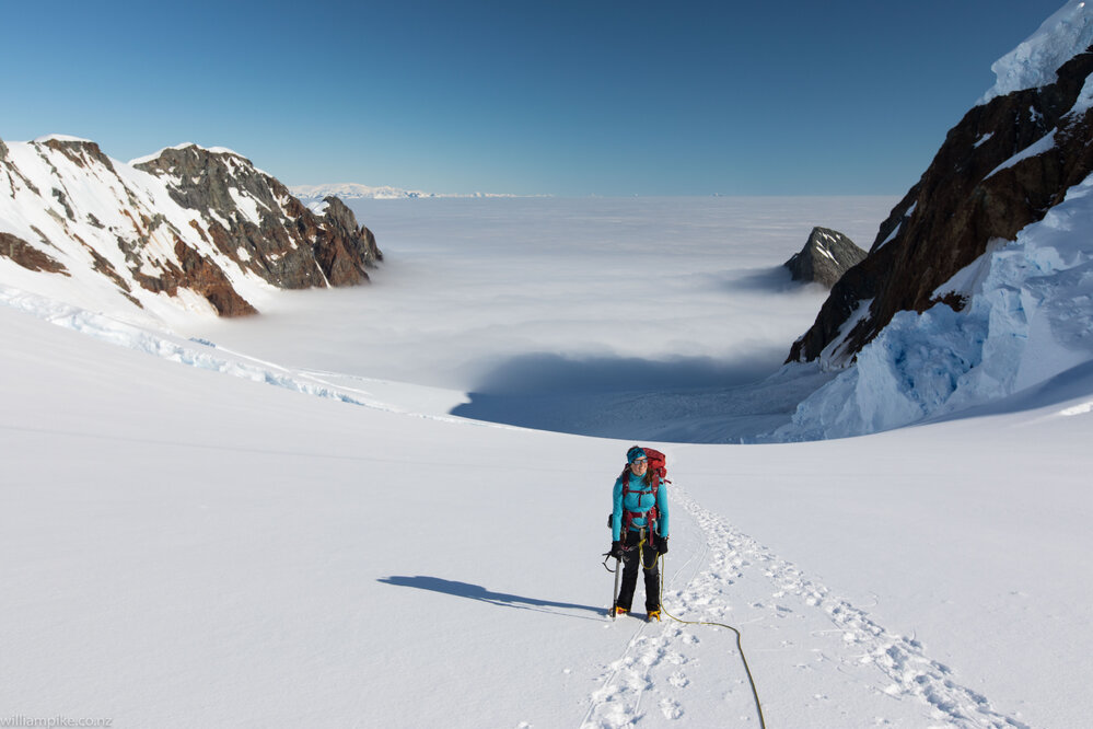 Inspiring Explorer Sylvie Admore above a sea of cloud on the slopes of Mount Scott