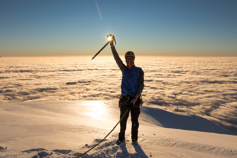 Inspiring Explorer William Pike celebrates on the summit of Mount Scott