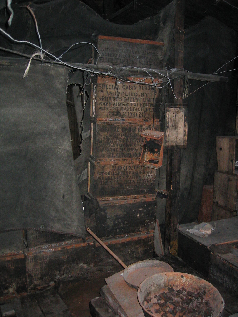 Stacked boxes and blubber stove in Scott's 'Discovery' Hut