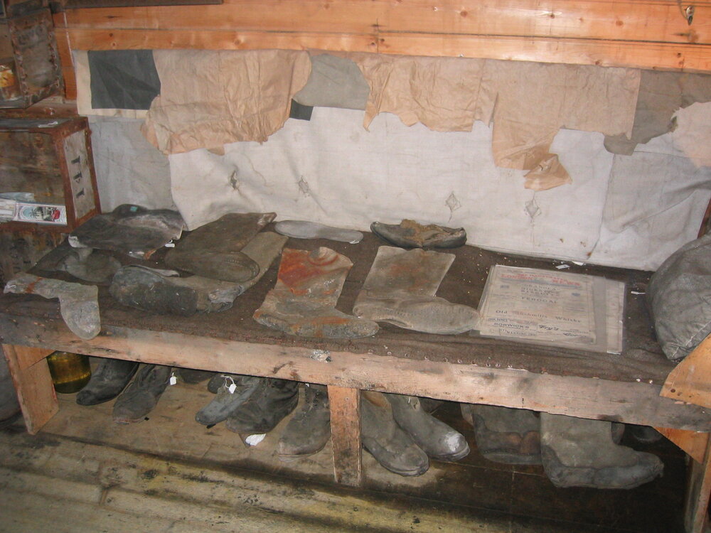 2003-04 Bunk and footwear along south wall in Shackleton's 'Nimrod' Hut (001)