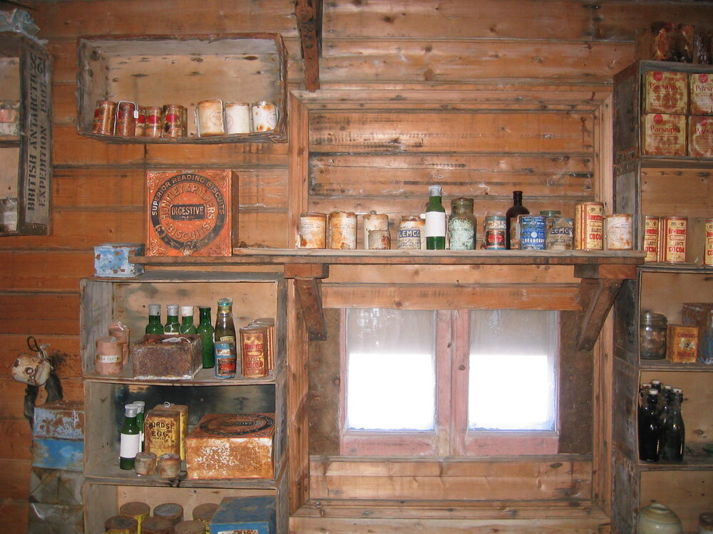 Shelved supplies and window on south wall of Shackleton's 'Nimrod' Hut