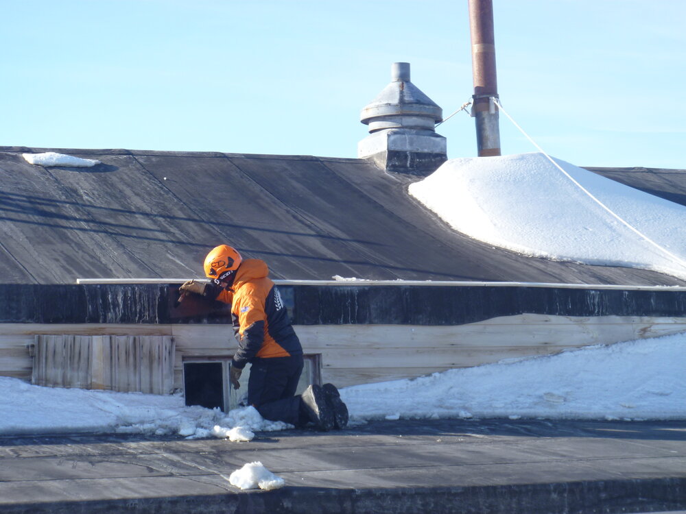 Painting the roof of Scott's 'Terra Nova' hut (007)