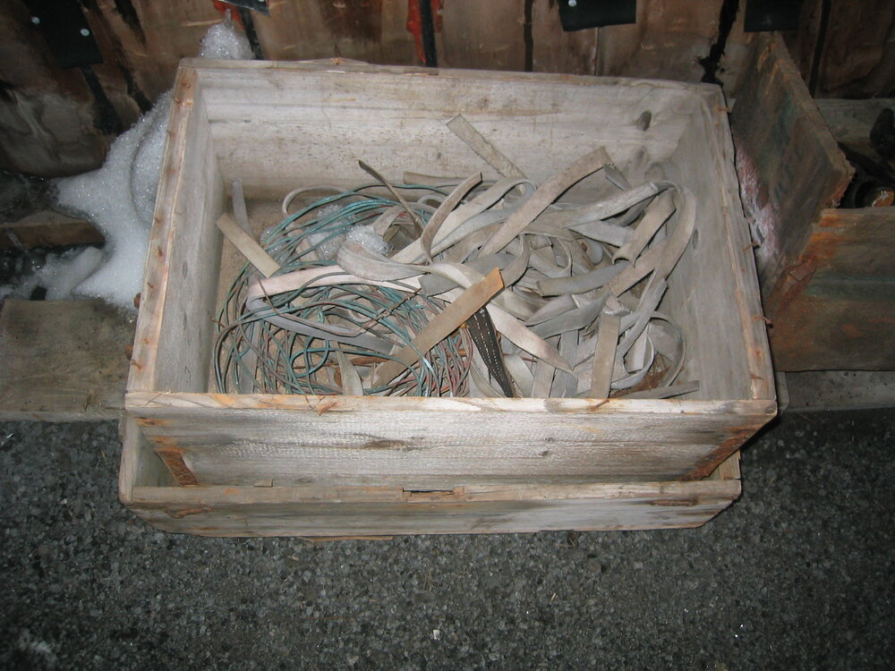 2003-04 Box containing straps (the same type used for fastening tools to wall), Western Annexe, Scott's 'Terra Nova' Hut