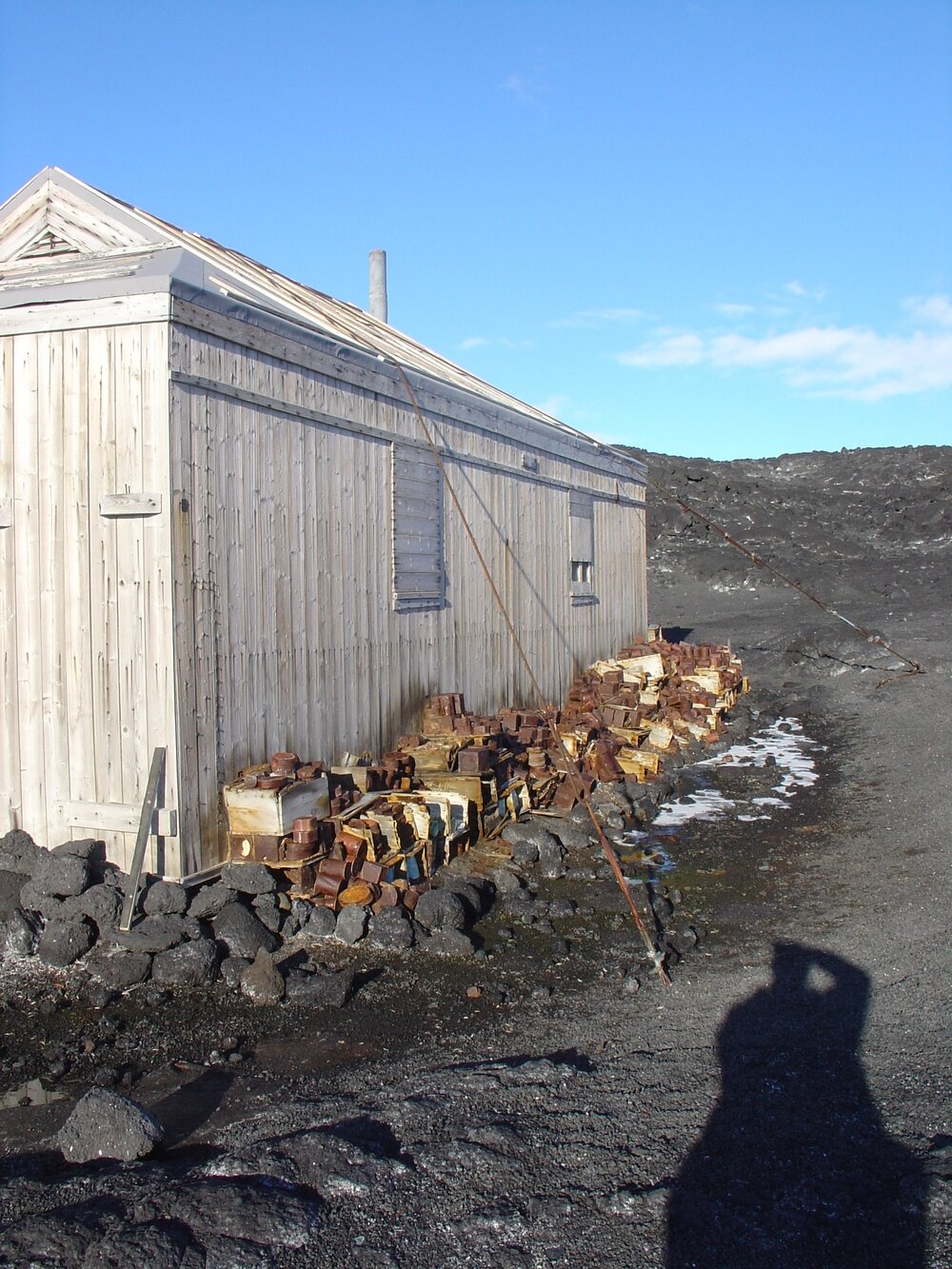 2003-04 Disintegrating Venesta boxes along southern exterior wall, Shackleton's 'Nimrod' Hut (004)