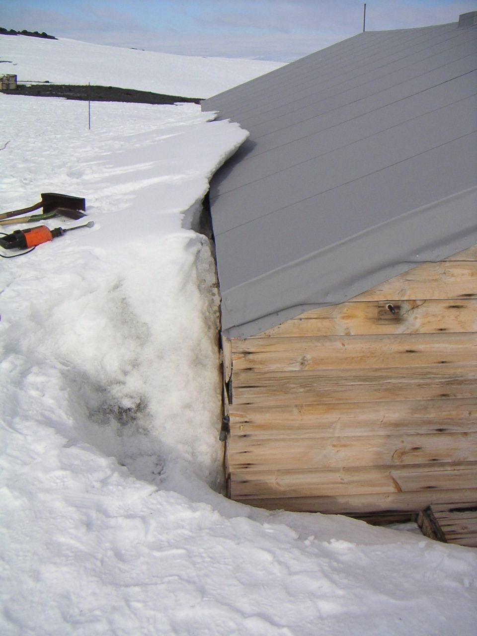 Snow build up on south wall of Scott's 'Terra Nova' Hut