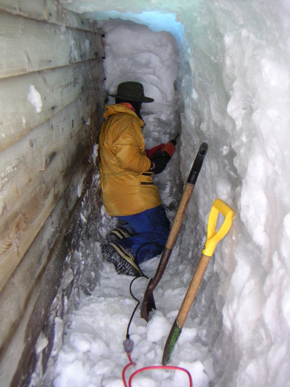 2002-03 Drilling away ice on south wall at Scott's 'Terra Nova' Hut