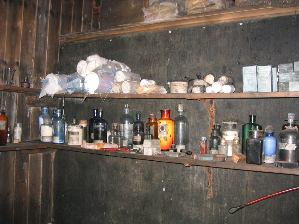 Medicines and shelving in Evans' and Wilson's corner 