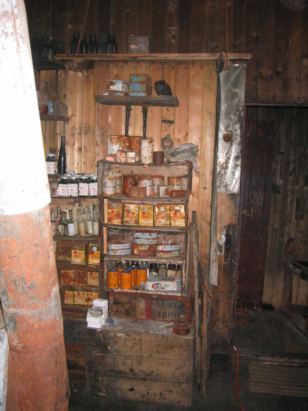 2003-04 Food supplies against west wall of Galley, Scott's 'Terra Nova' Hut