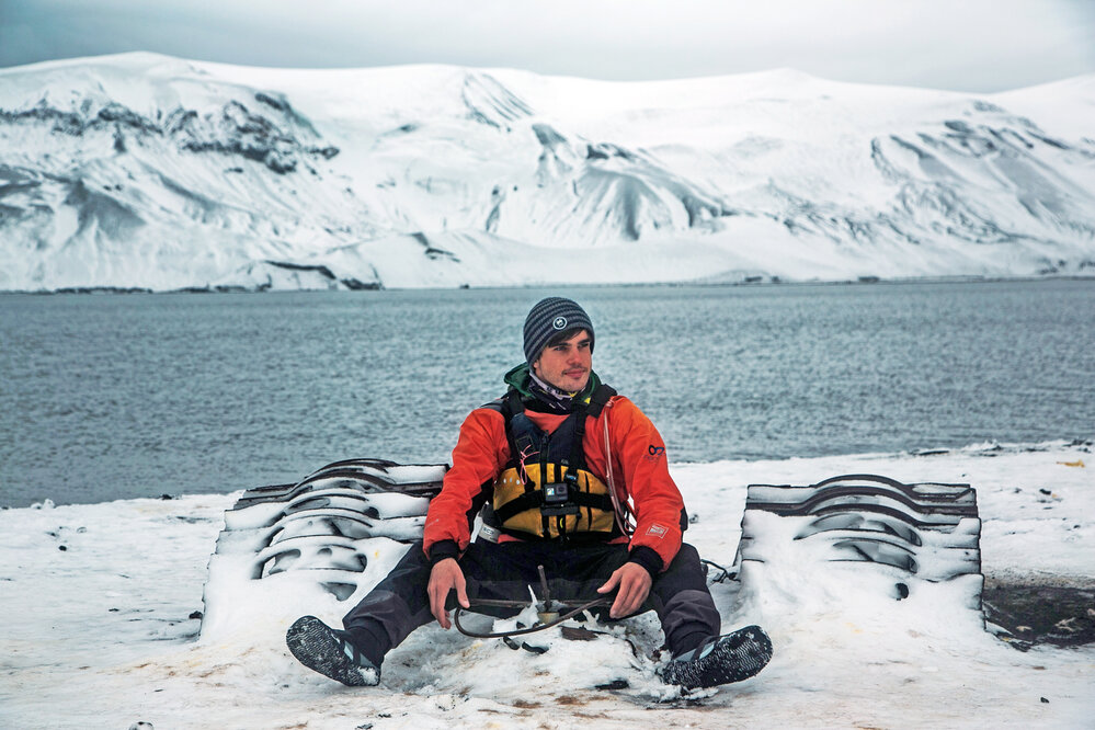 Alexander Hillary with a half buried Massey Ferguson tractor on Deception Island