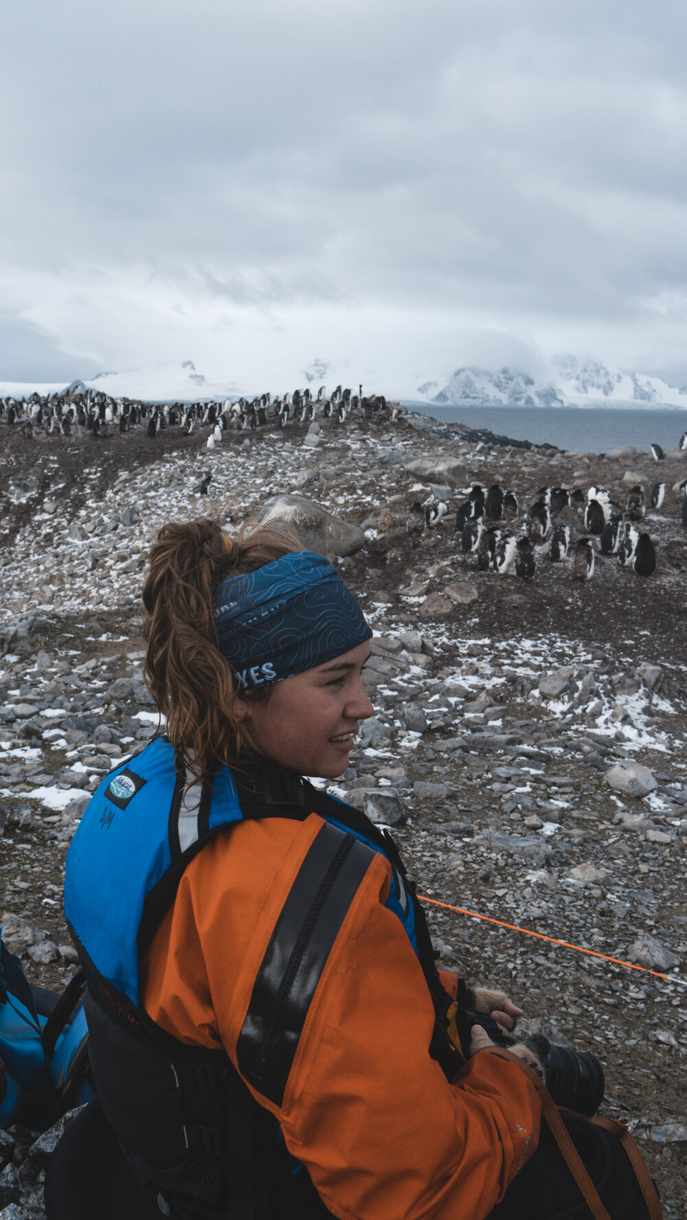Inspiring Explorer Leah Stewart photographing chinstrap penguins on Antarctic Peninsula