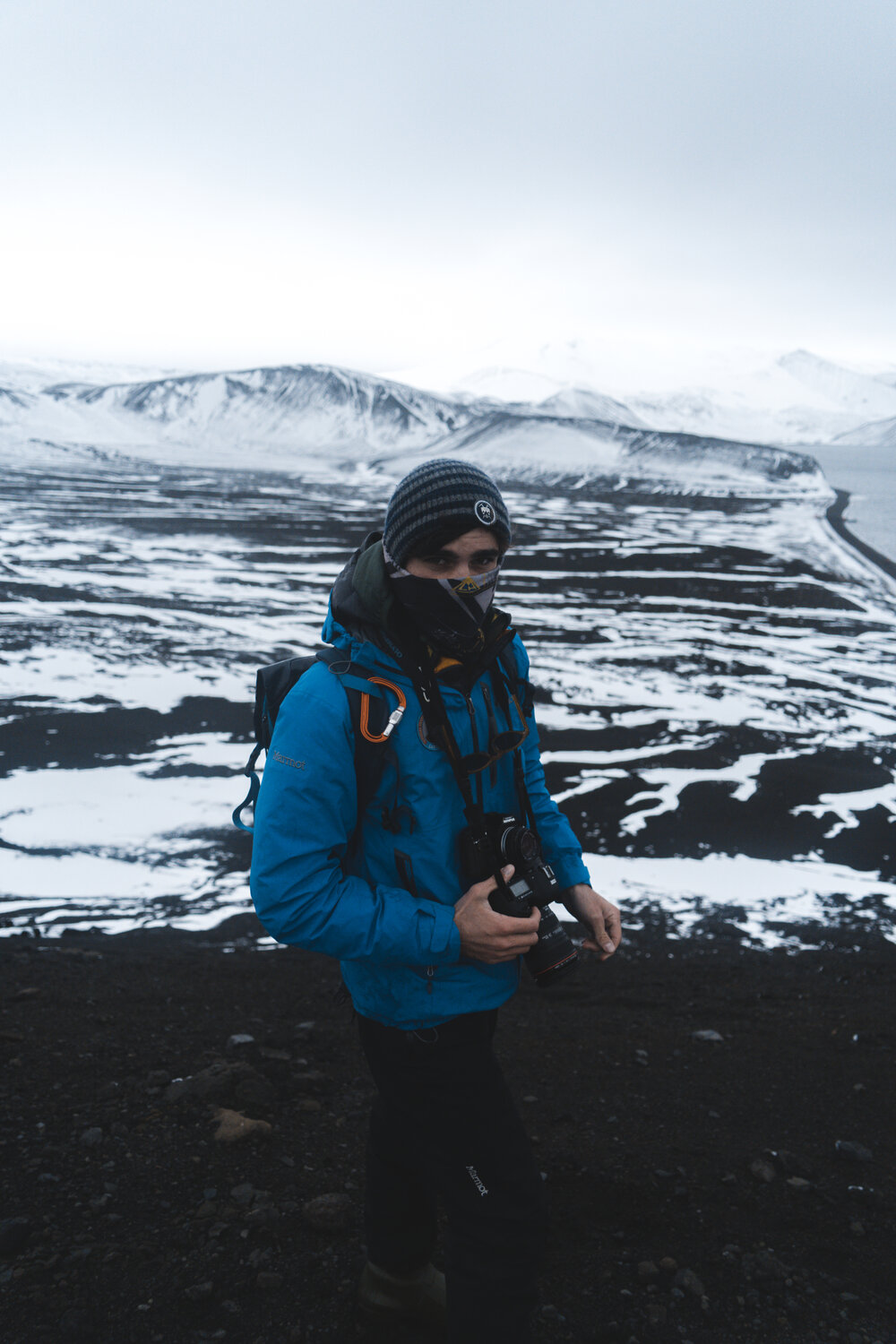 Alexander Hillary with camera on Deception Island