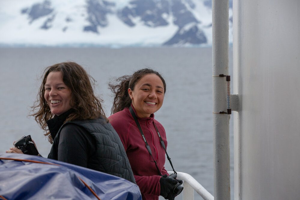 Georgie Archibald and Lana Kiddie-Vai smiling while photographing aboard 'Navigator'